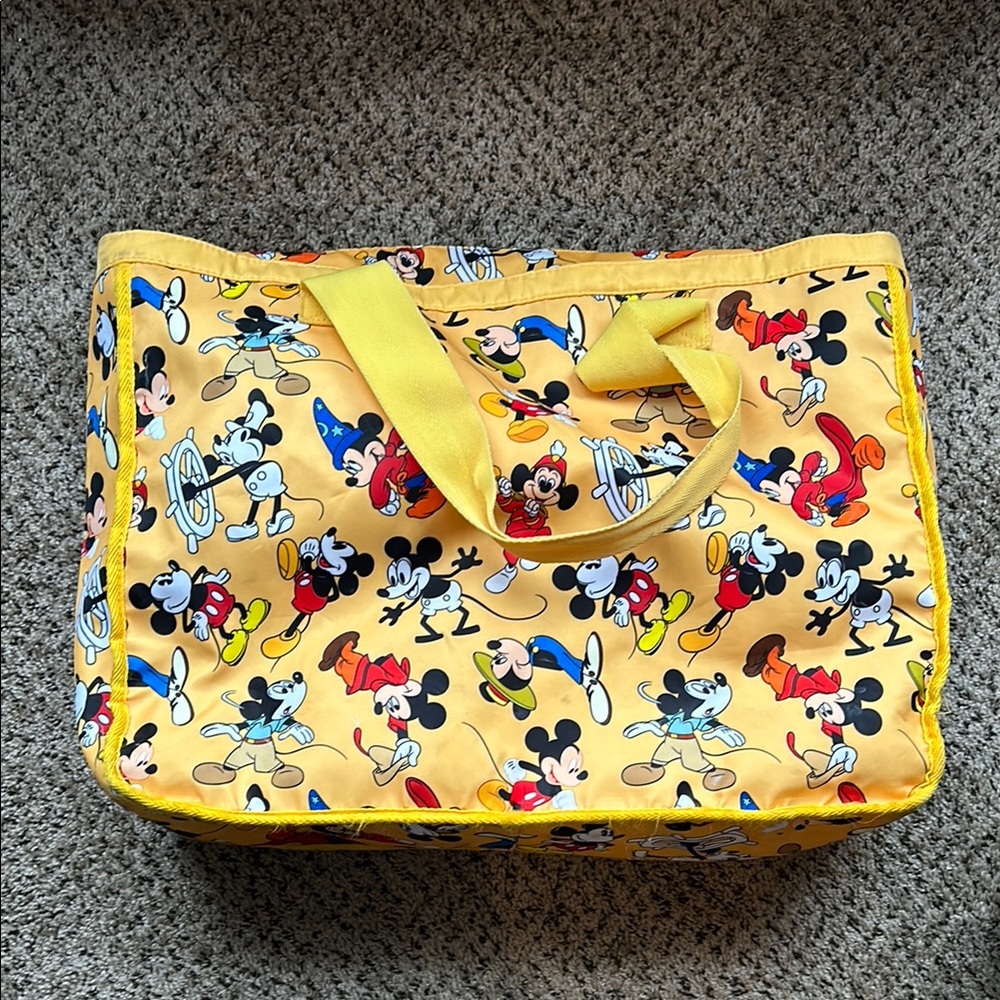 Mickey Mouse takes you back in time with this vibrant tote bag!